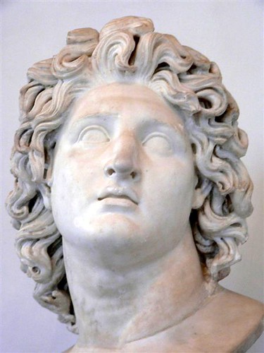 Marble copy of 4th century BCE portrait of Alexander the Great exhibiting typical characteristics of sculpture by Lysippos - tilted head, detailed hair, eyes gazing upward and lips slightly parted.