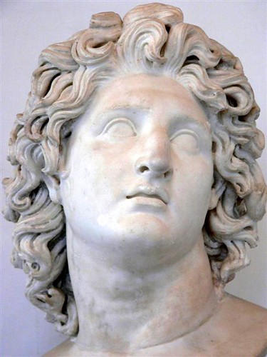 Marble copy of 4th century BCE portrait of Alexander the Great exhibiting typical characteristics of sculpture by Lysippos - tilted head, detailed hair, eyes gazing upward and lips slightly parted.