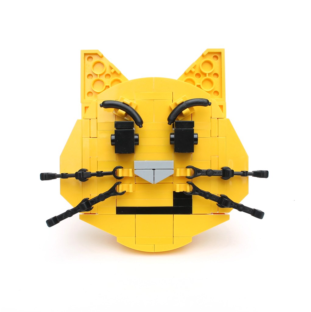 Bonus Brick-moji: Cat face with wry smile