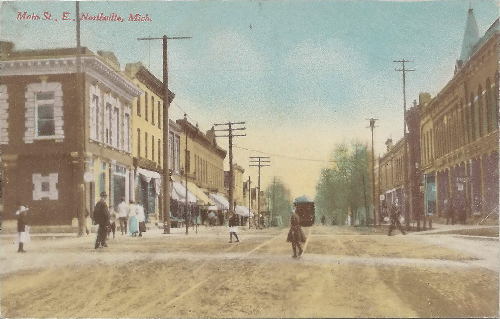 SE Northville MI RPPC 1911 Downtown Stores and Businesses near Stimpson Scale & Mfg & the PNRR Plymouth & Northville RR Depot & Yard in the INDUSTRIAL DISTRICT Dirt Street Horse & Buggy Era